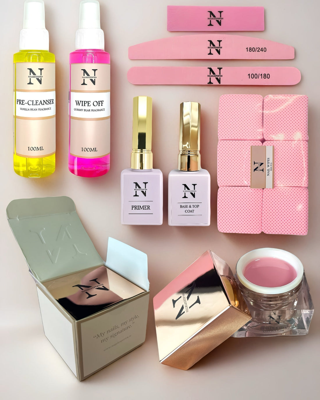 Paket med tio nagelprodukter för nagelförlängning som inkluderar nagelfilar, builder gel och nagel prep i olika färger.