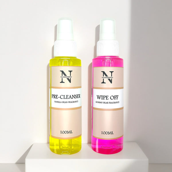 Två flaskor innehållande cleaner för nagel preparering i gul och rosa färg.