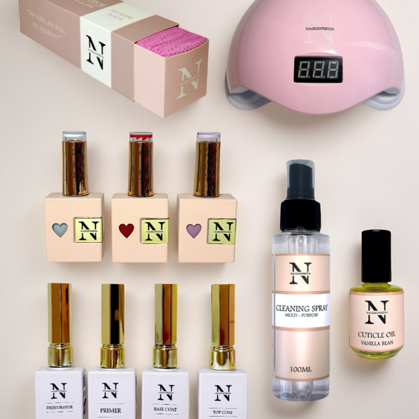 Gellack startkit med rosa UV-lampa, gellack, base coat och top coat.