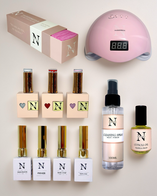 Gellack startkit med rosa UV-lampa, gellack, base coat och top coat.